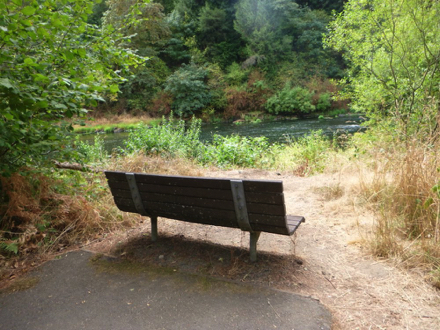 Transition from paved trail to natural surface with bench – may have a lip